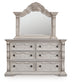 Bruchandi King Upholstered Panel Bed with Mirrored Dresser and Nightstand